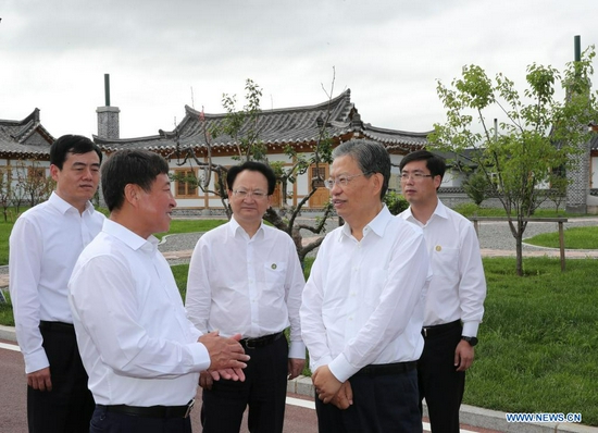Zhao Leji, a member of the Standing Committee of the Political Bureau of the Communist Party of China (CPC) Central Committee and secretary of the CPC Central Commission for Discipline Inspection, visits Taixing Village in Yanji City to learn about residents' livelihood and their access to medical service and elderly care, in northeast China's Jilin Province, July 9, 2021. Zhao made an inspection tour in Jilin from Friday to Sunday. (Xinhua/Ding Haitao)